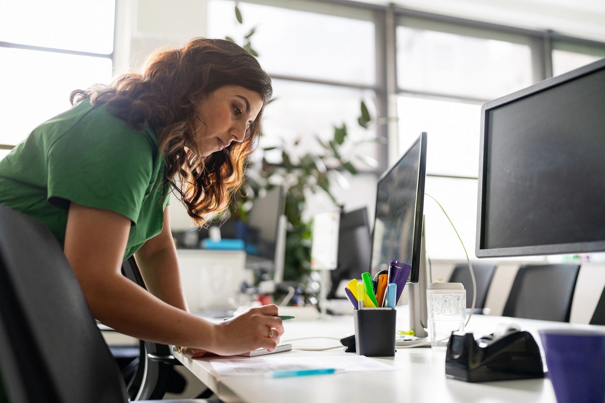 Professional making thoughtful career decisions at a desk