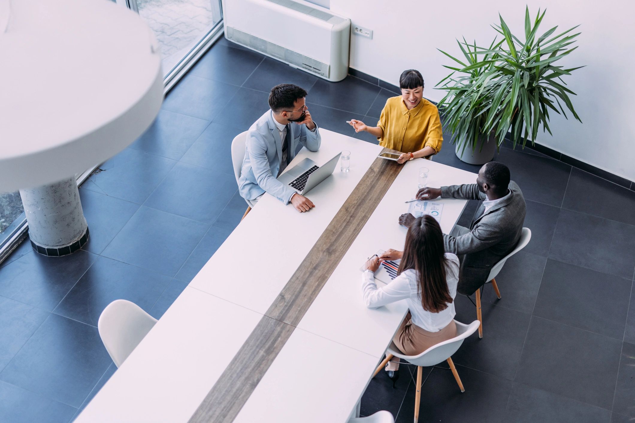 Executive team meeting viewed from above in a boardroom